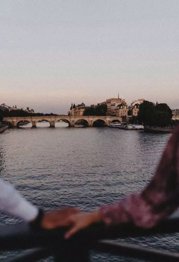 A couple holding hands in Paris